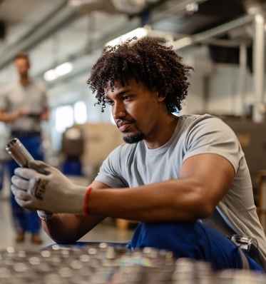 Worker Inspecting Product