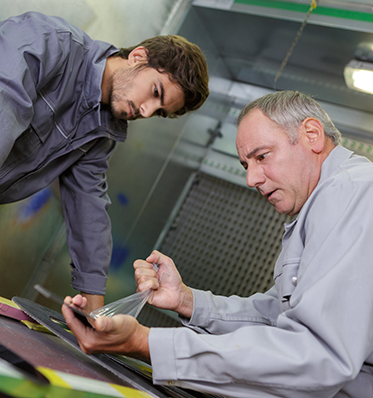 two men working together